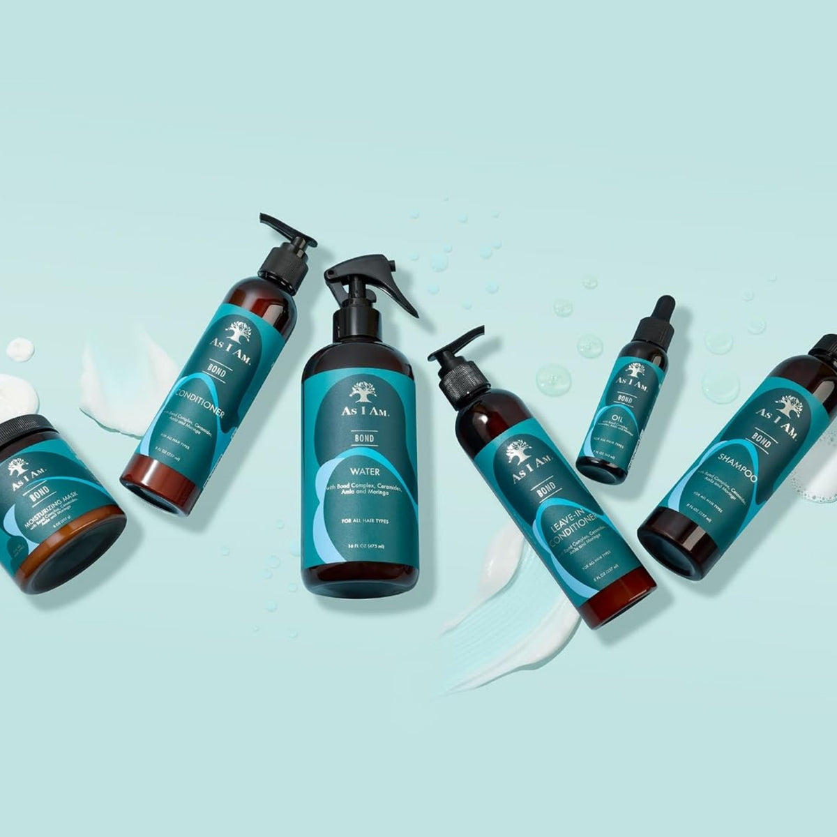 As I Am Bond hårplejeserie med shampoo, balsam, leave-in, olie, spray og maske i mørke flasker med teal etiketter.