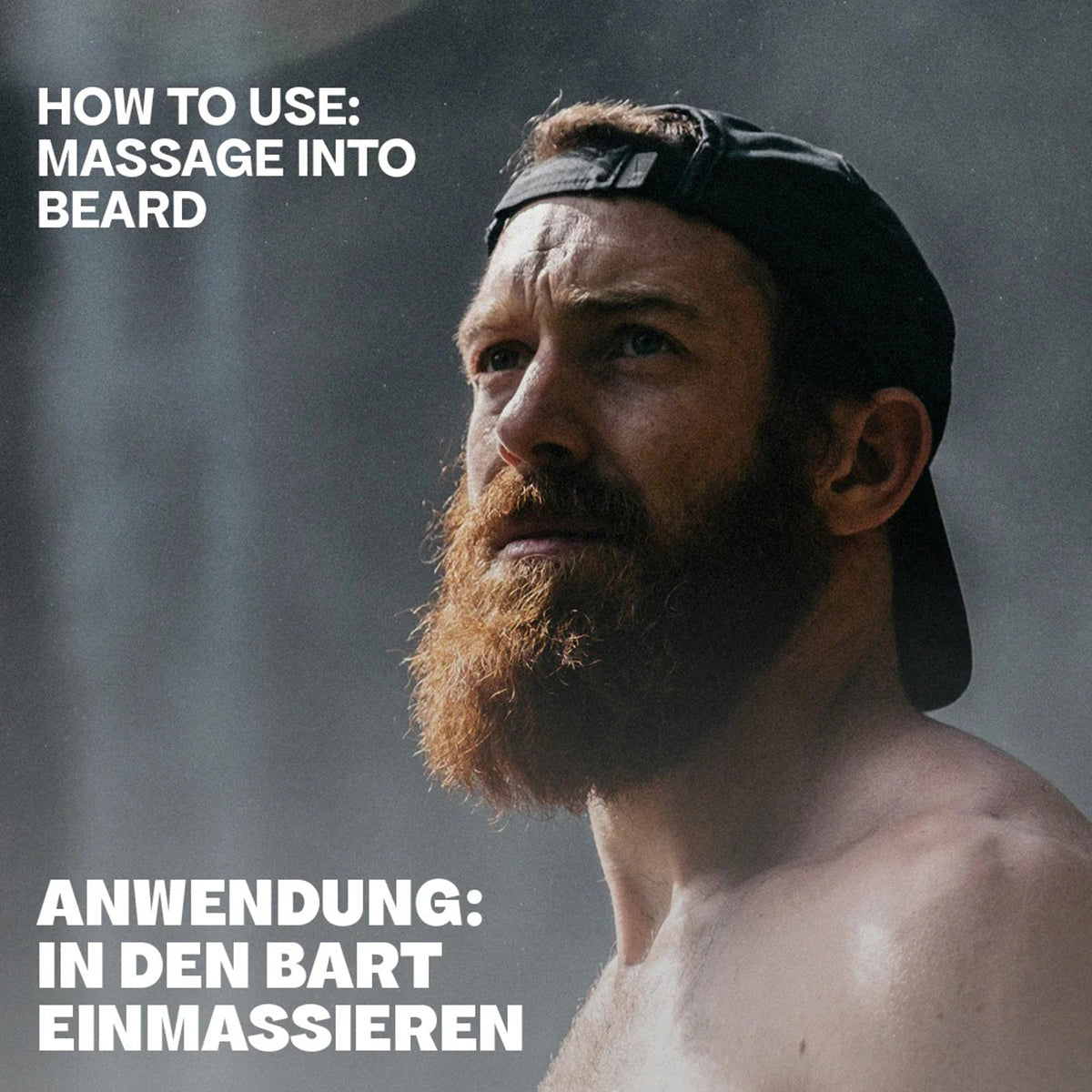 Mann mit vollem, kastanienbraunem Bart und Kappe demonstriert die Verwendung von Bali Gents Bartöl 30 ml, indem er es in den Bart einmassiert.