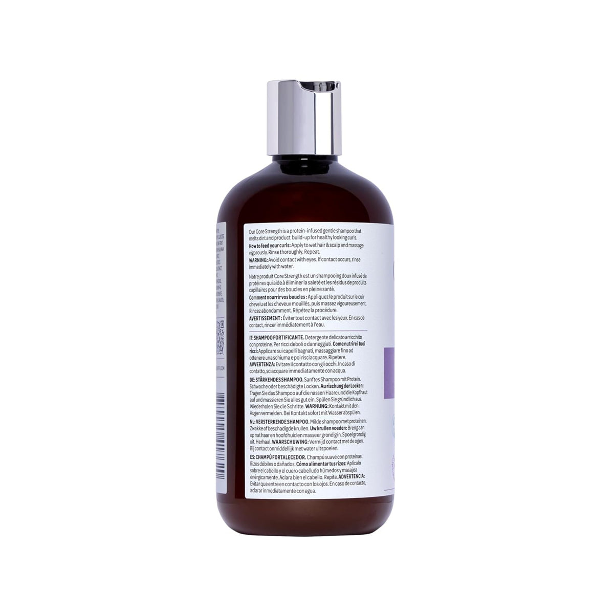 Braune Plastikflasche mit silbernem Deckel von Core Strength Shampoo mit Etikett in mehrsprachiger Gebrauchsanweisung.